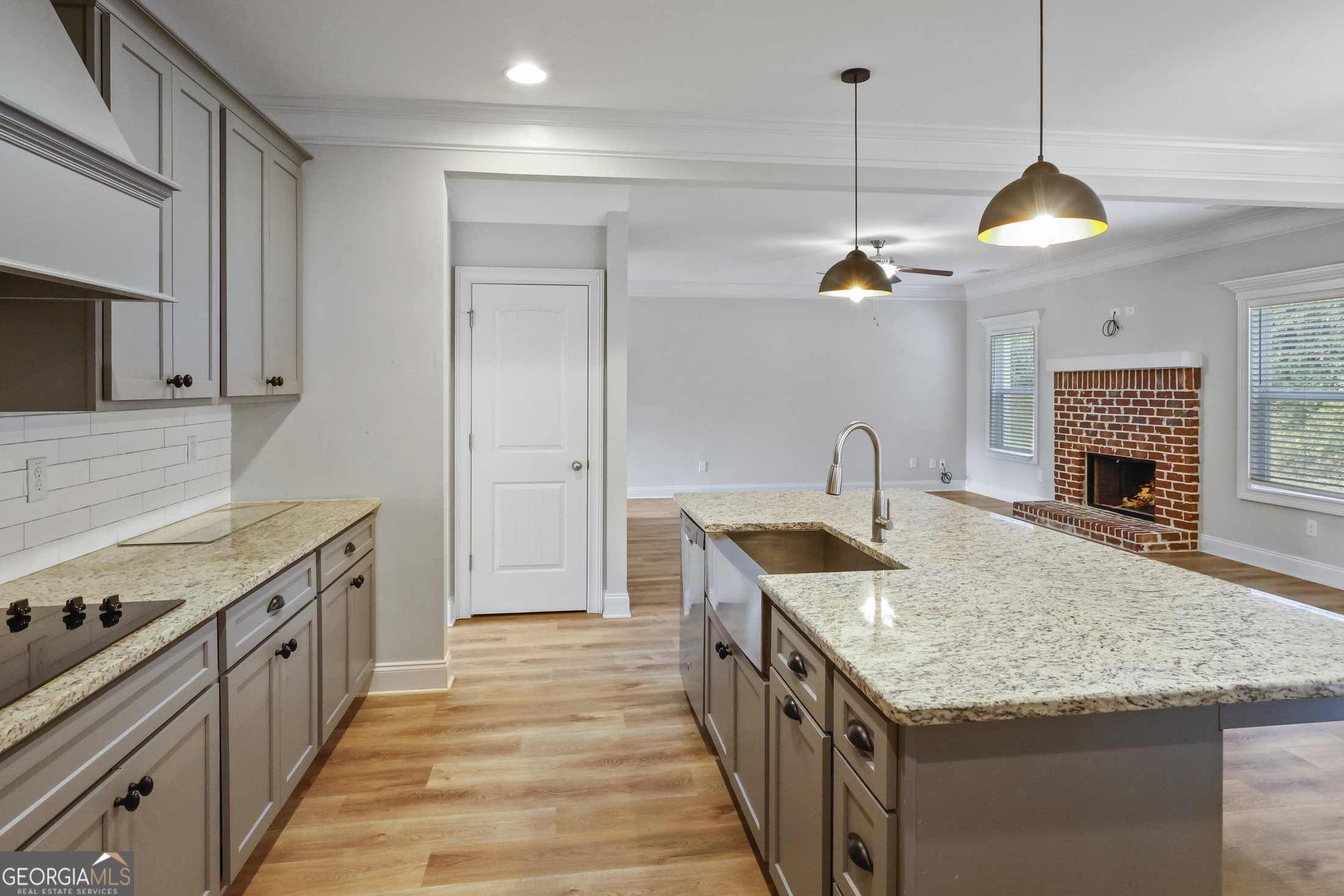Professionally photographed open kitchen with large island